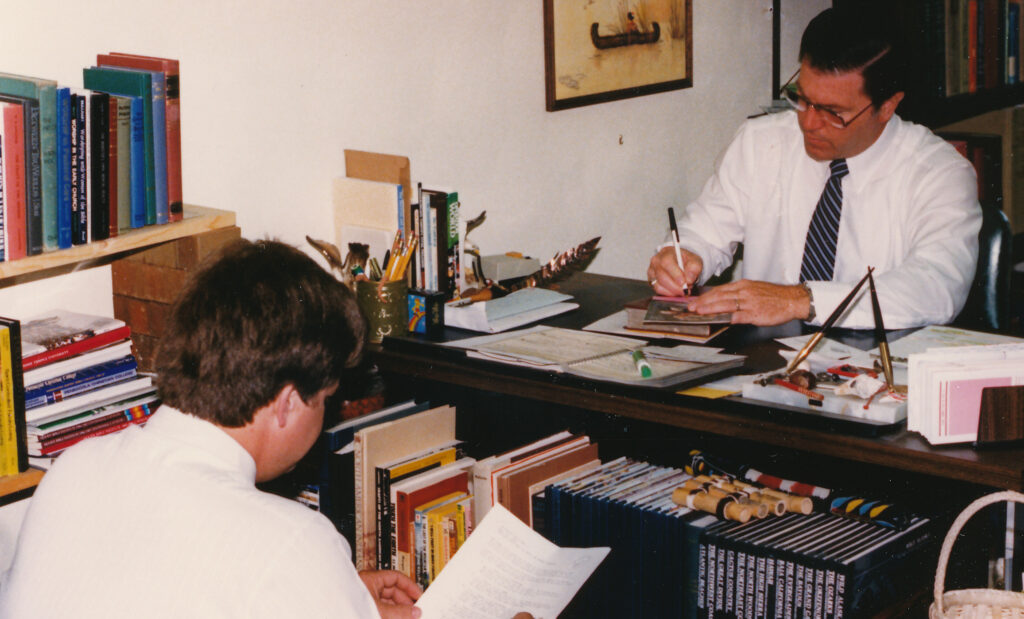 Pastor Denny Schlappi and Pastor Phil Somers working together.